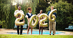 Happy people, portrait and new year with numbers for festive party, celebration or event by pool. Group, friends or team with date or summer break for december holiday, weekend or reunion together 