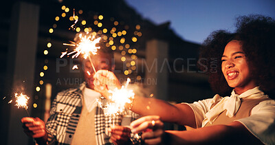 Buy stock photo Outdoor, night and happy as couple with sparklers for new year and festive season celebration. Dark, people and excited or fun in relationship with fireworks for special occasion, event and festival