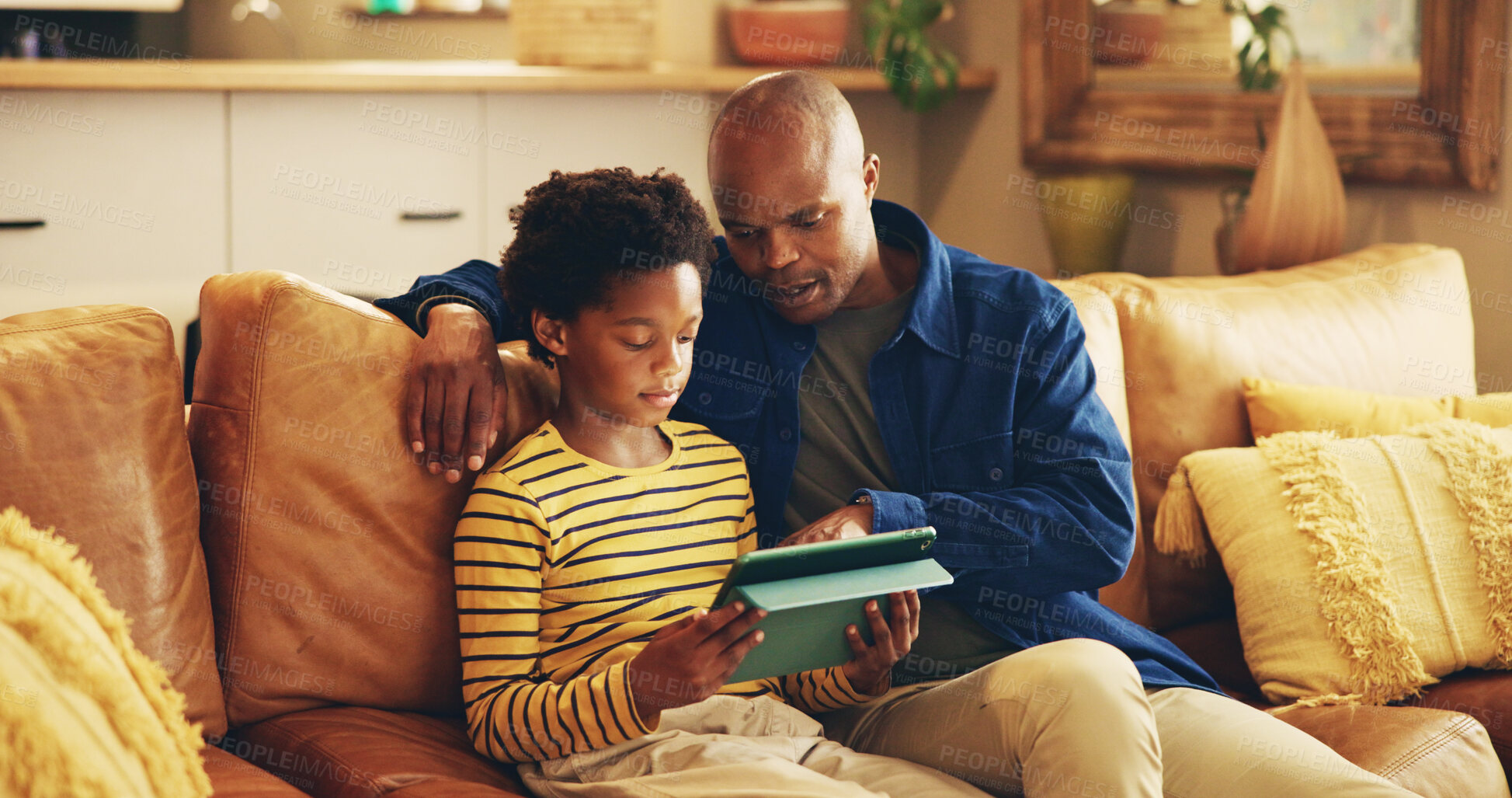 Buy stock photo Teaching, dad and child with tablet, home and elearning with app in living room, bonding and internet. House, man and son with tech for education, growth and development for boy, knowledge and online