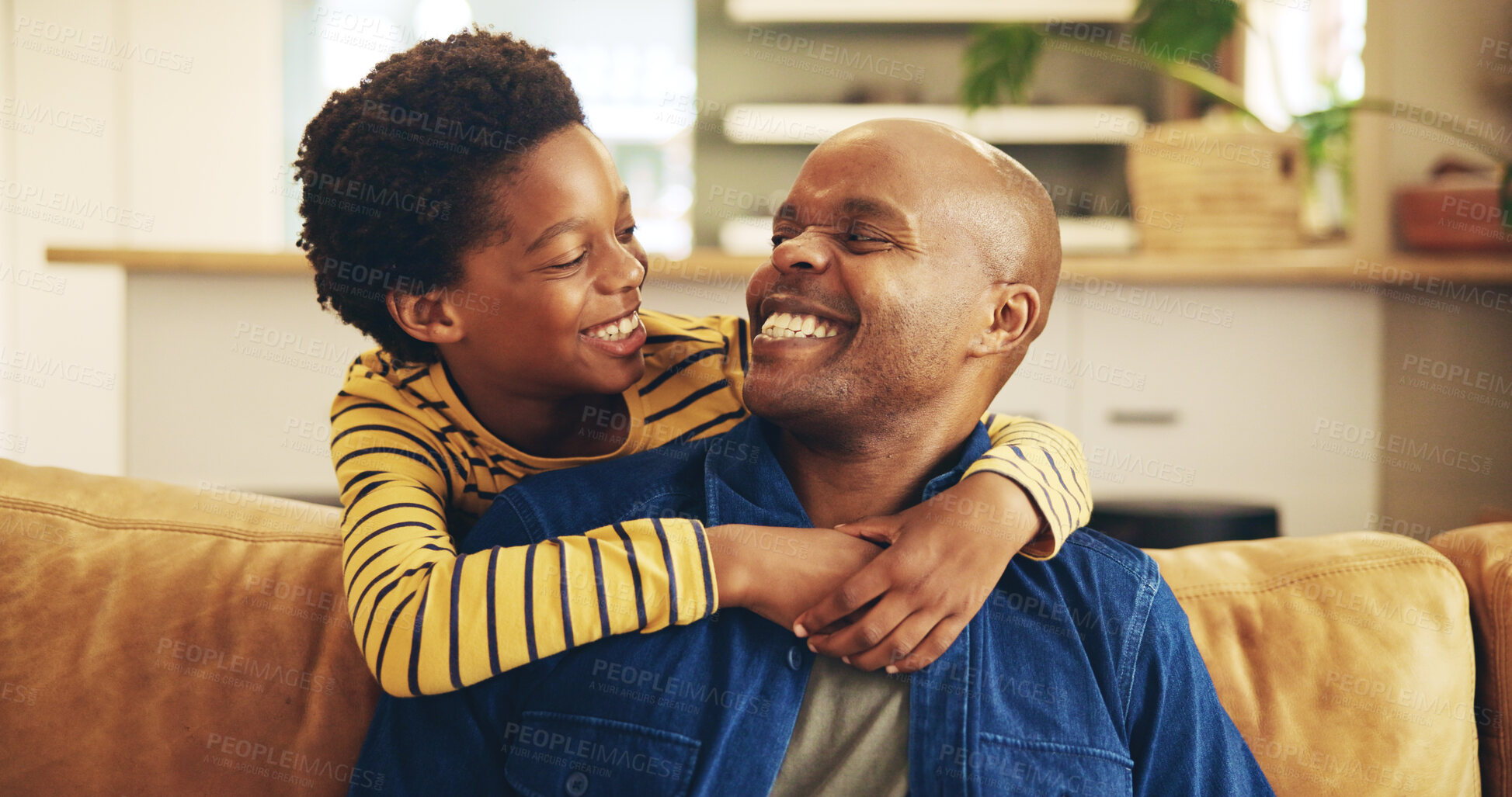 Buy stock photo Bonding, hug or smile with dad and son on sofa in living room of home together for development. Black family, happy or love with boy child embracing single parent man in apartment for affection