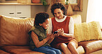 Mother, child and happy with tablet on sofa for teaching online app, playing educational games and bonding. African people, woman and boy kid in home with digital tech for internet browsing and relax