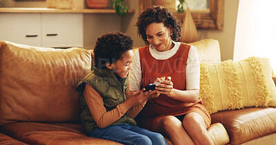 Buy stock photo Mother, child and happy with tablet on sofa for teaching online app, playing educational games and bonding. African people, woman and boy kid in home with digital tech for internet browsing and relax