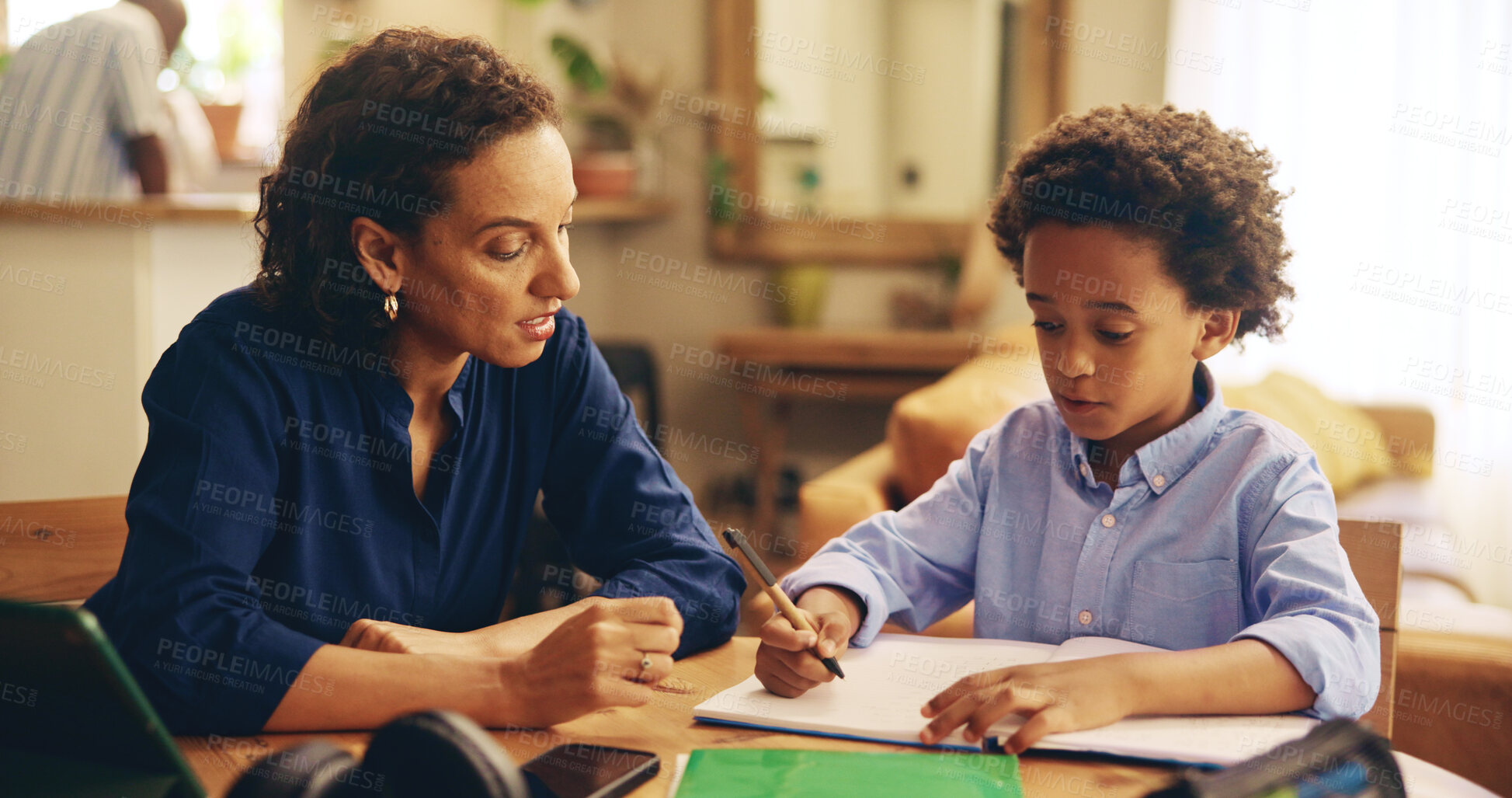 Buy stock photo Mom, child and writing with book for homework, education or learning with helpful tutor at home. Mother, boy or kid with notes for homeschooling, childhood development or assistance on table at house