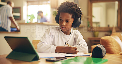 Buy stock photo Video, online and child with headphones, tablet and boy with information, education and studying for exam. Desk, growth and development of kid, listening and podcast for knowledge, African and home