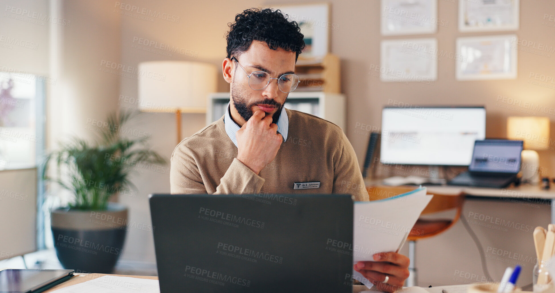 Buy stock photo Doctor, man and laptop with documents in clinic for checking patient information and medical records. Healthcare, professional and paperwork for test results, health treatment planning and insurance