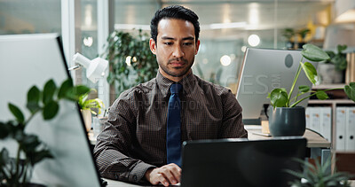 Buy stock photo Asian, research and businessman in office with laptop for typing, creative agency or self publishing. Online, writer or worker with internet, computer or pc for editing of ebook novel with technology