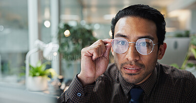 Buy stock photo Glasses, reading and online with business man in office for research, planning and website portal. Email, news and report with male employee in agency for communication, networking and reflection