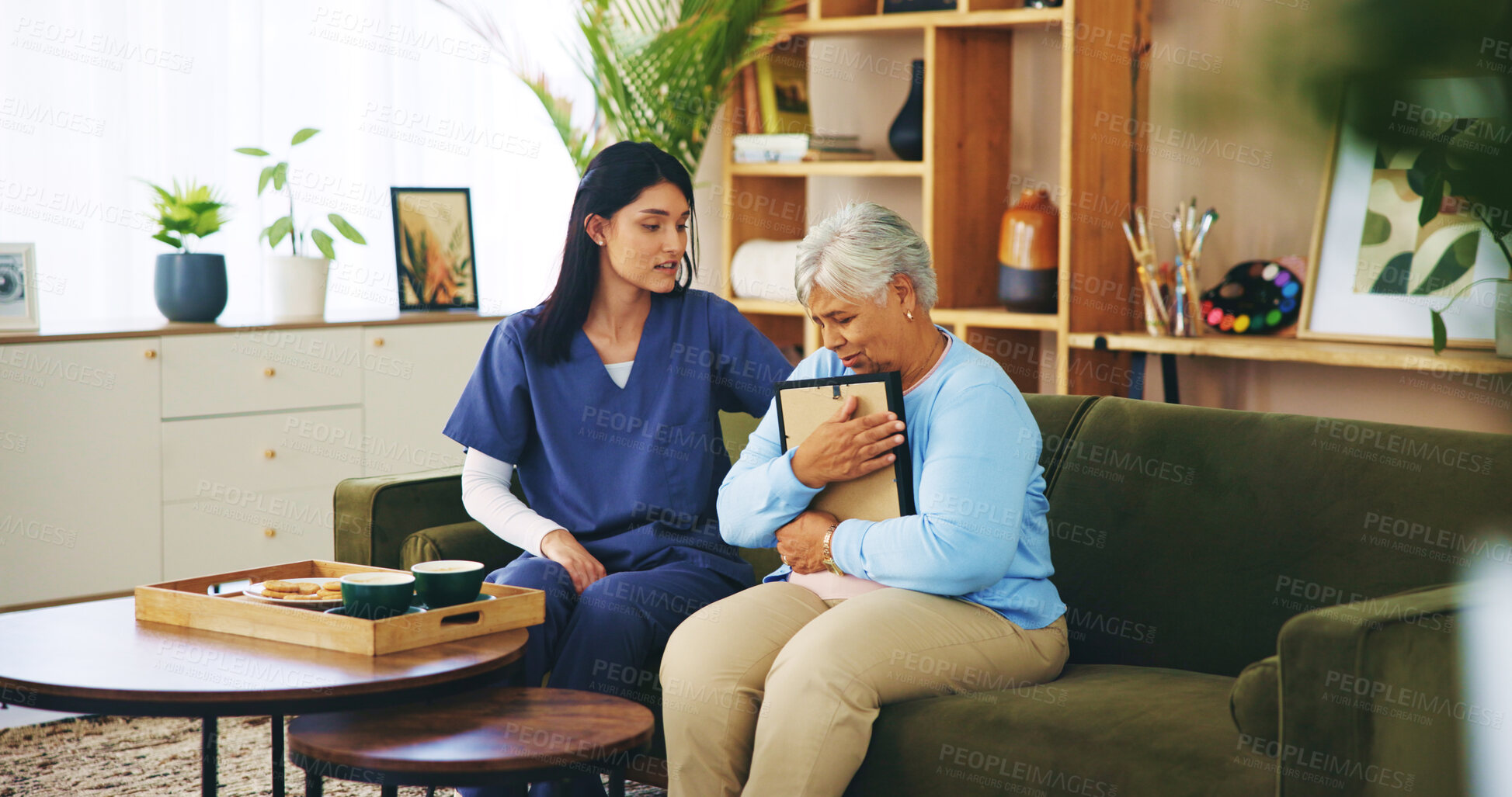 Buy stock photo Picture, sad and old woman on sofa with nurse for senior care, support and grief counseling at home. Homecare, elderly widow and caregiver on couch with lonely memory, empathy and comfort in loss