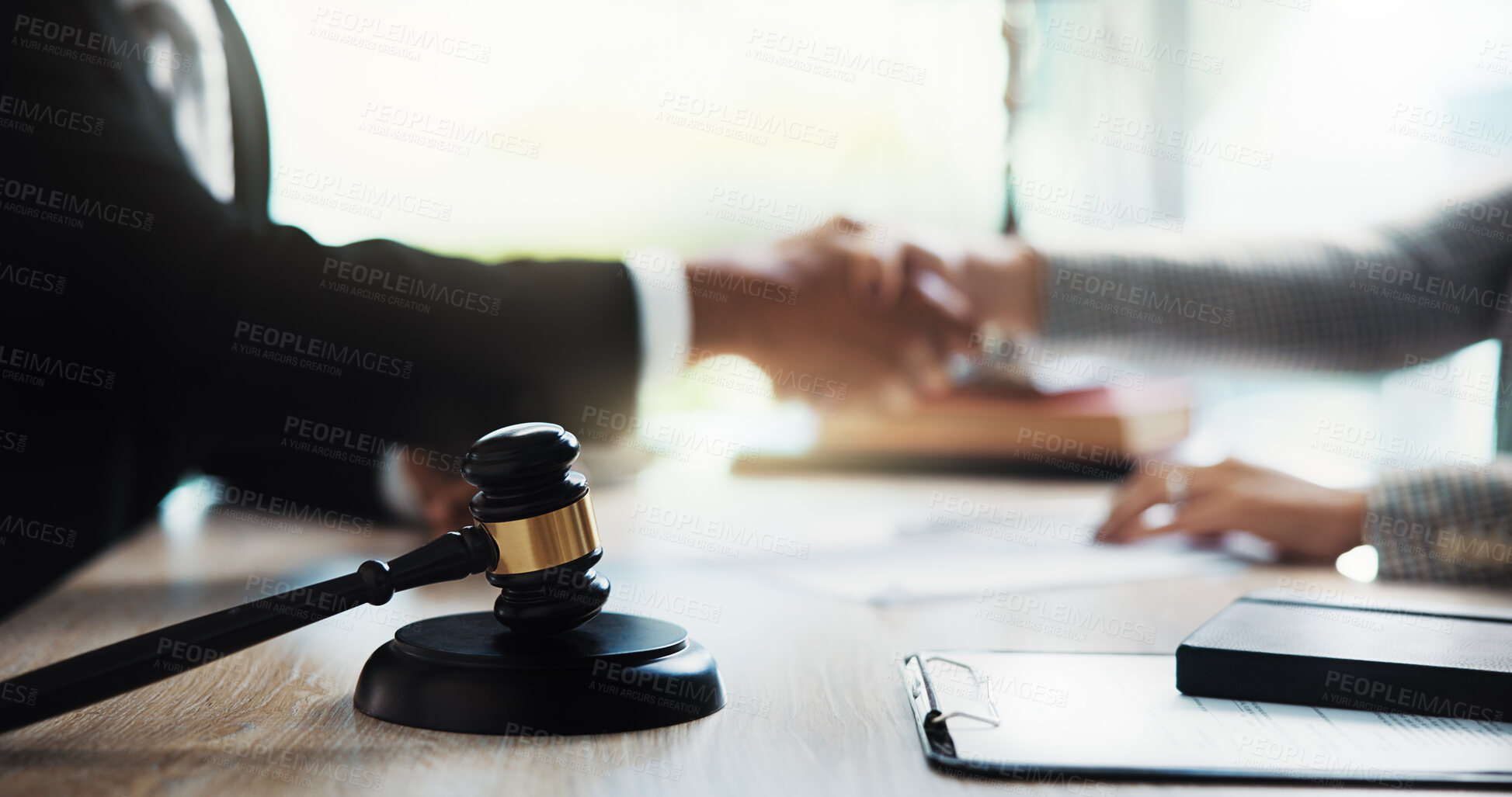 Buy stock photo Judge, handshake and lawyer in office with gavel on table for legal agreement. Attorney, business people and shaking hands for success, justice and support with lawsuit settlement or negotiation