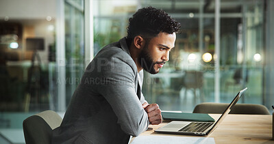 Buy stock photo Laptop, office and businessman reading email, sales report or budget proposal at night. Computer, online and worker check financial results, review and communication for revenue or profit on overtime
