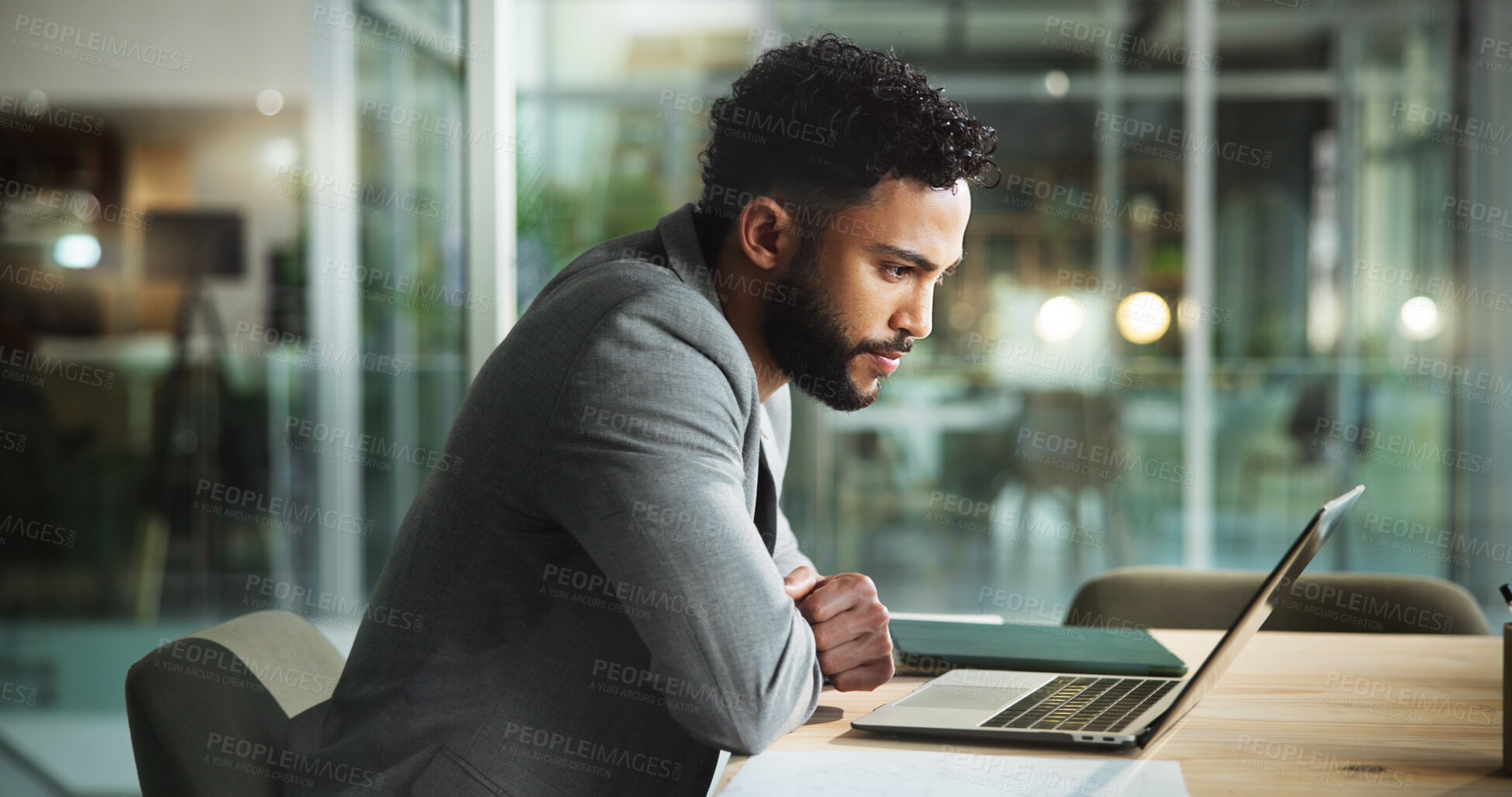 Buy stock photo Laptop, office and businessman reading email, sales report or budget proposal at night. Computer, online and worker check financial results, review and communication for revenue or profit on overtime
