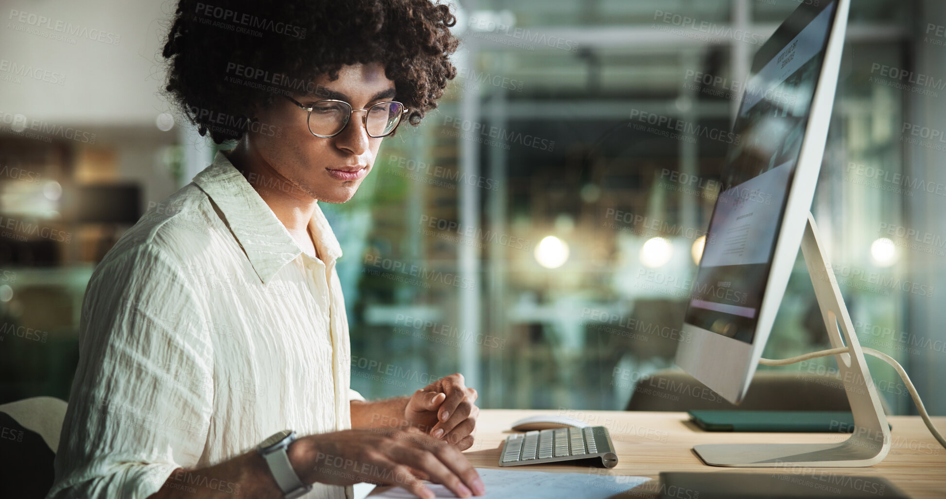 Buy stock photo Computer, reading and business man with document in office for creative blog, comparison or content writing. Research, startup and worker check paperwork for social media project on overtime at night