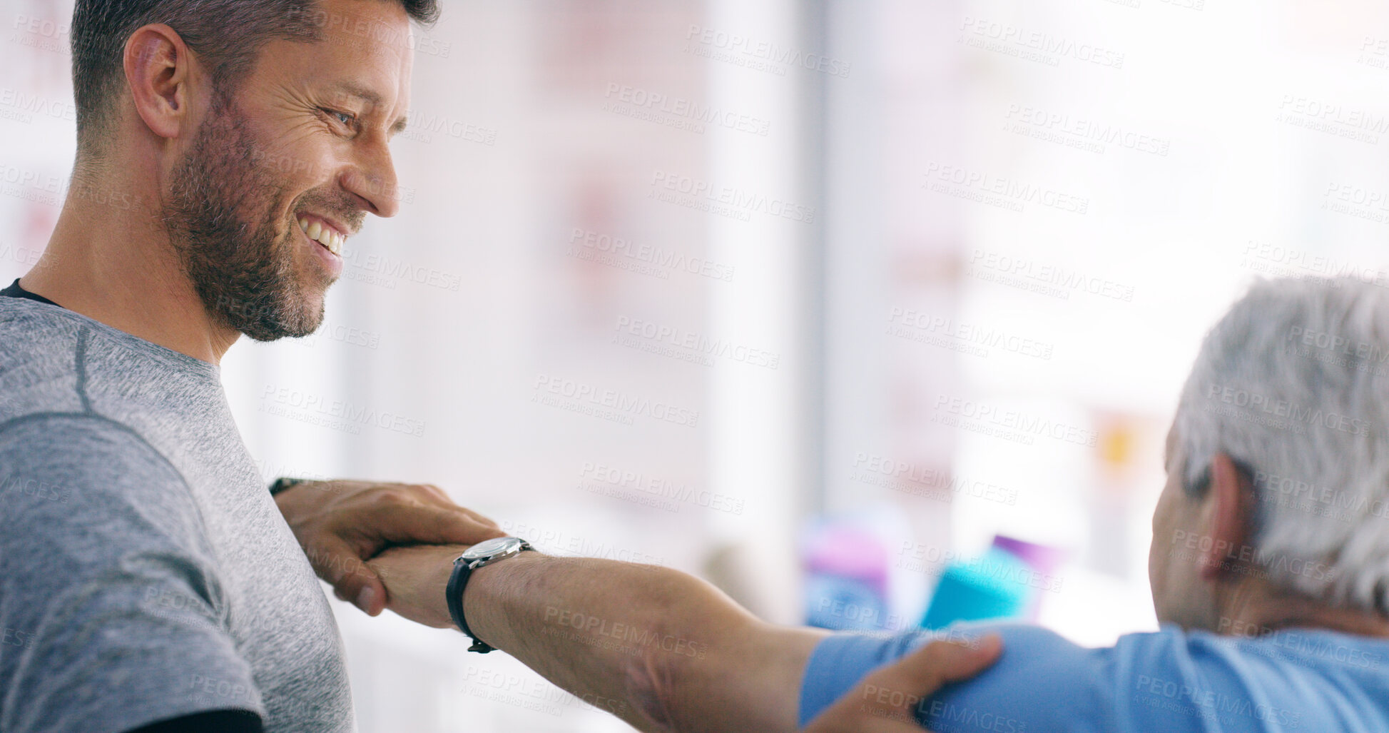 Buy stock photo Man, physiotherapy or patient in office for elderly care, arm exercise or smile for client progress. Senior person, chiropractor or joint pain in practice with mobility, muscle strength or healthcare