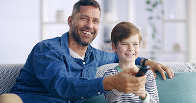 Buy stock photo Father, boy and watching tv with remote on couch, relax and smile in living room at family house. Dad, child and happy together with hug for streaming, video and cartoon movies with bonding in home