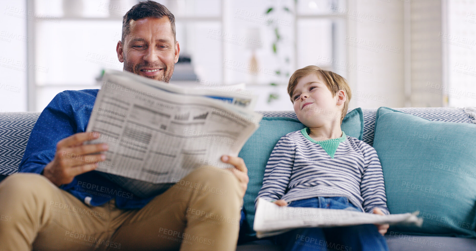 Buy stock photo Home, father and child with newspaper for reading, article updates and cognitive development on sofa. Happy people, dad and boy with information for knowledge, current events and bonding in lounge