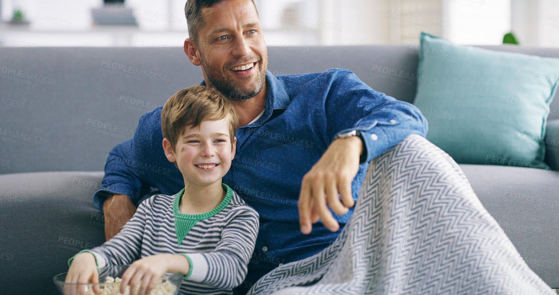 Buy stock photo Dad, boy and watching tv on floor, popcorn and smile with streaming in living room at family house. Father, child and happy with snack for television, subscription and movies with bonding in home