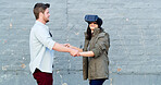Couple, virtual reality and headset in street with game, laugh or guide for rpg with futuristic tech in city. Woman, man and happy with holding hands, ar glasses or play in metaverse on road in Spain