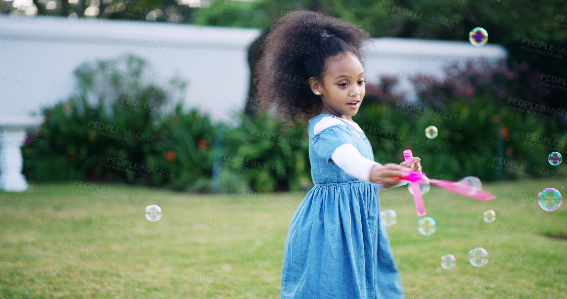 Buy stock photo Black child, girl and bubbles in garden for fun, game and childhood development at home. Young kid, soap toy and wand in backyard with coordination, creative activity and playing in yard with freedom