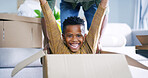Black child, portrait and boxes game with parent in new home, relocation fun and playing support. Son, father and pushing kid in cardboard for fantasy race in living room, energy and moving house