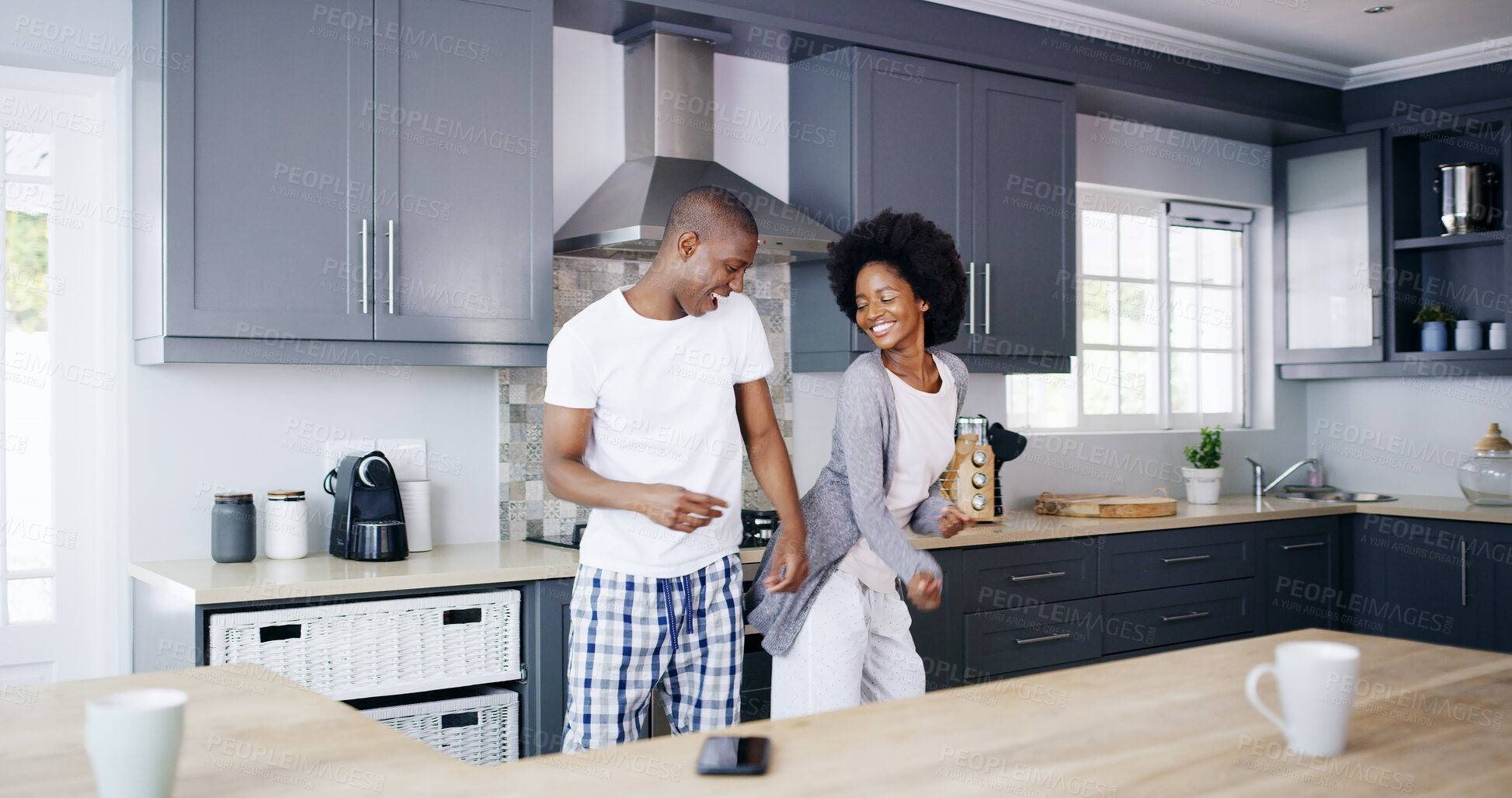 Buy stock photo Couple, kitchen and happy with dancing in morning for bonding together, connection and enjoyment. Love, black people and dancer in home for anniversary celebration, relationship and weekend energy
