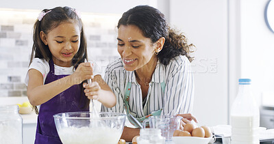 Buy stock photo Family, mom and girl with kitchen, baking and learning with ingredients for support and dessert cake. Smile, happy mother and cooking daughter help for bonding, cookies or recipe preparation in home