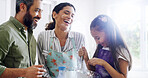 Parents, kid and laugh in kitchen for baking, bonding and messy at counter with learning. Mother, father and child in family home for relationship development, education and help making treat for fun