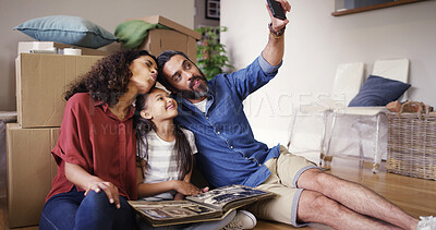 Buy stock photo Family, real estate and people with selfie in new house for property relocation, moving in memory or funny face. Parents, child and photography on floor for milestone, social media post or investment