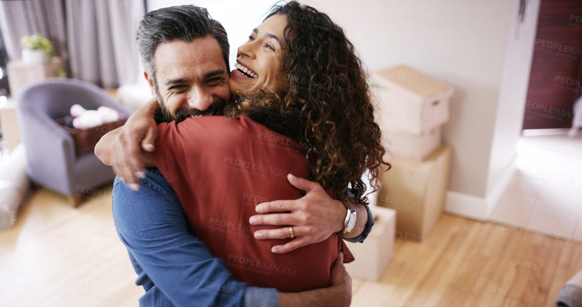 Buy stock photo Happy couple, hug and celebrate moving in new home, relocation success and homeowners for mortgage. People, embrace and proud of real estate achievement in living room, support and house security