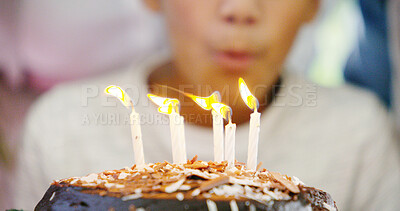 Buy stock photo Birthday cake, celebration and blowing candles for child and flame to make a wish and enjoy surprise at home. Kids, dessert and hope at party event with food, chocolate and closeup of prayer in house