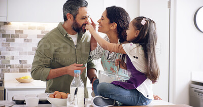 Buy stock photo Parents, child and flour in kitchen for baking, bonding and messy at counter with learning. Mother, father or kid in family home for relationship development, education or help playing games for fun