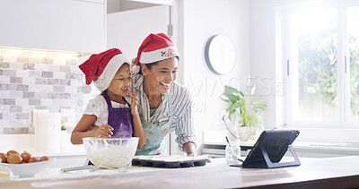 Buy stock photo Tablet, baking and laughing with mom, girl and bonding in kitchen for Christmas, food and recipe blog. Cooking, nutrition and help with mother in family home for daughter, search and meal prep
