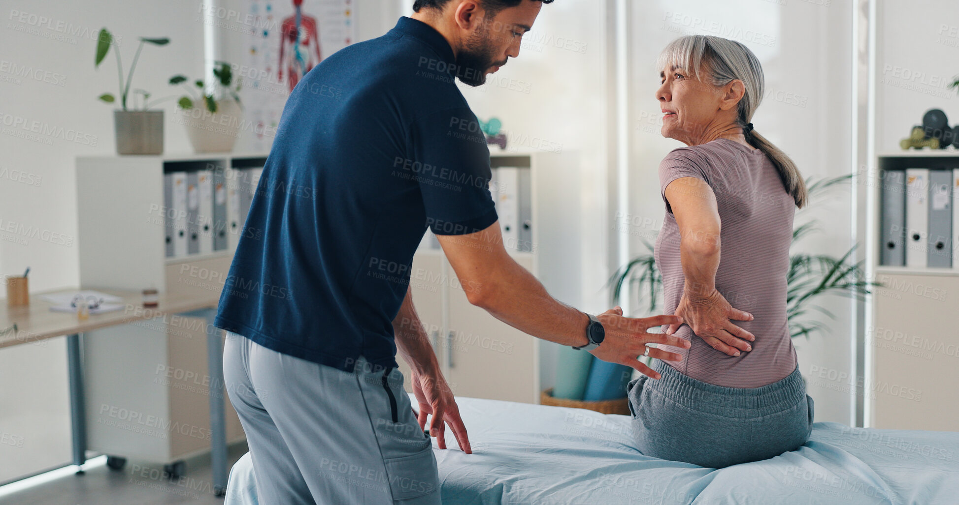 Buy stock photo Back pain, physiotherapy and advice with old woman in clinic for healthcare, osteoarthritis or symptoms. Medical, physical therapy and helping with patient for chiropractor and rehabilitation