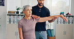 Arm, physiotherapy and stretching with old woman in clinic for healthcare, osteoarthritis or symptoms. Medical, physical therapy and help with patient for chiropractor, consulting and rehabilitation