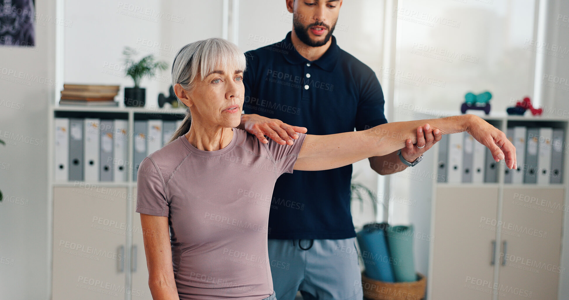 Buy stock photo Arm, physiotherapy and stretching with old woman in clinic for healthcare, osteoarthritis or symptoms. Medical, physical therapy and help with patient for chiropractor, consulting and rehabilitation