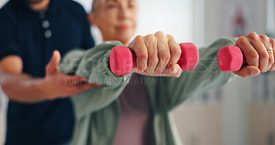 Buy stock photo Physiotherapy, woman or hands with dumbbells for rehabilitation, muscle exercise or body health. Mobility, client or stretching with light weights for fitness, physical recovery or help with balance