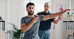 Physical therapy, stretch arm and patient man at consultation for problem, inflammation or shoulder. Person, chiropractor and exercise for injury, rehabilitation and recovery of muscle damage