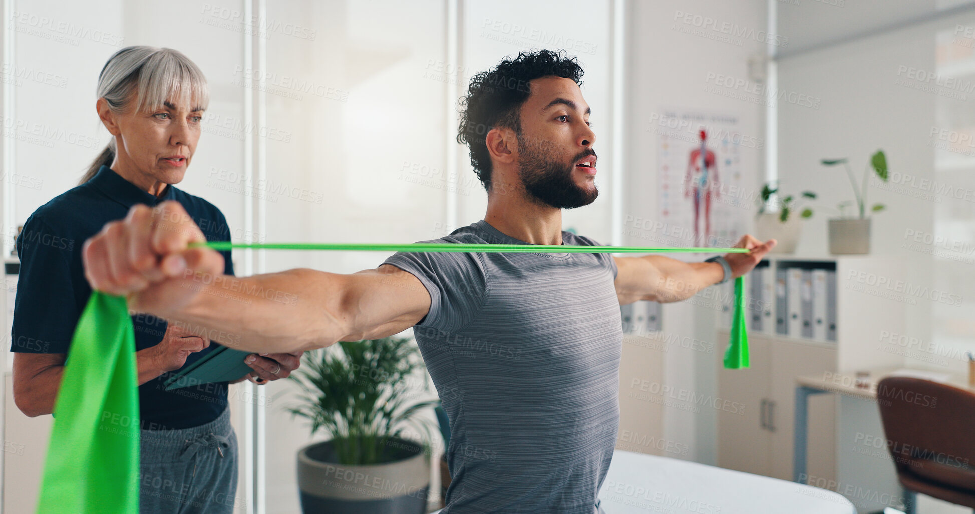 Buy stock photo Physiotherapy, stretching or man with resistance band for arms recovery, muscle exercise or health. Mobility help, shoulder or male client with elastic for fitness, physical rehabilitation or balance