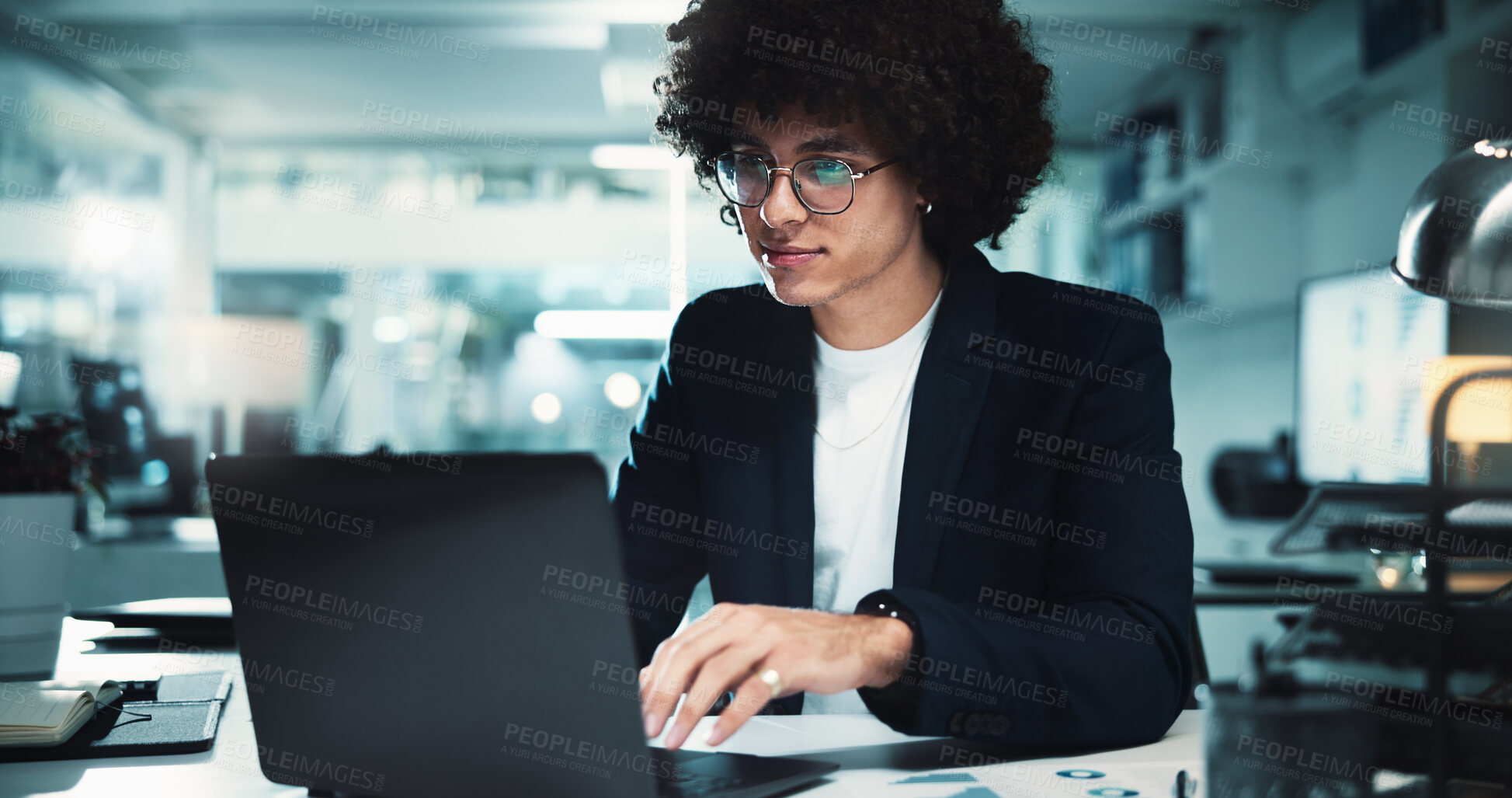 Buy stock photo Night, man and laptop in office with glasses, finance management and budget review at paper. Accountant, tech and profit report in agency for audit deadline, tax compliance and vision for information
