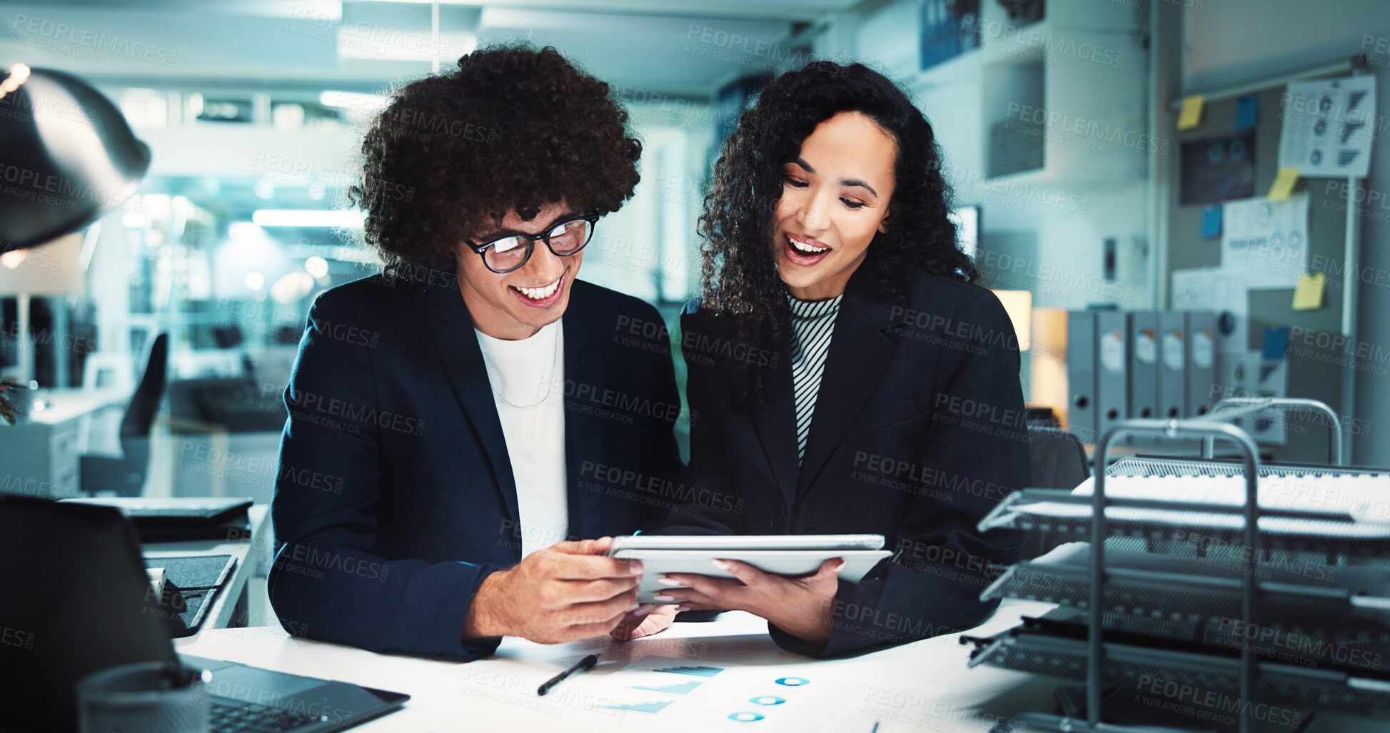 Buy stock photo Happy, business people or night with tablet for analytics, company statistics or profit at office. Businessman, woman or colleagues working late with smile on technology for corporate revenue or data