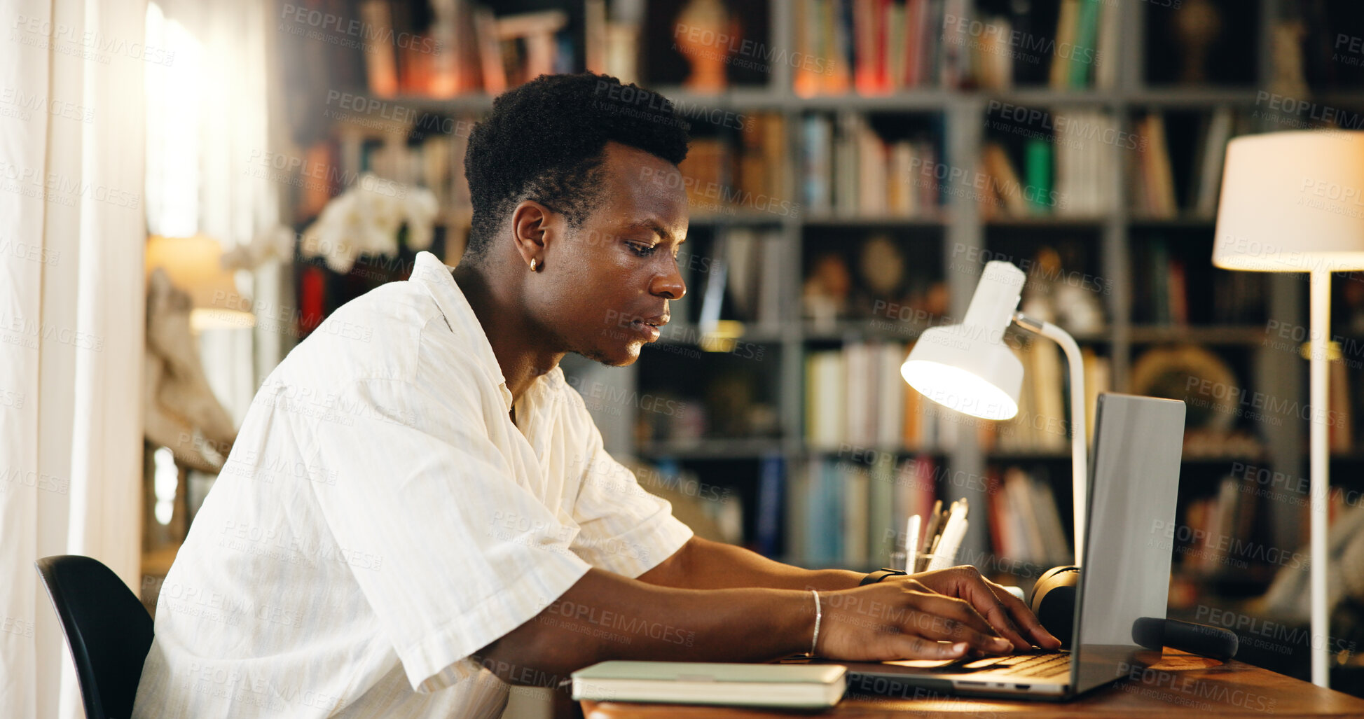 Buy stock photo Laptop, college and typing with black man in home office for research, online course and scholarship. Education, university student and elearning webinar with person and study for report and project