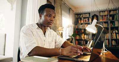 Buy stock photo Black man, e learning and typing on laptop, home and reading with studying, development and research in library. Person, computer and music with education, project and online course at apartment