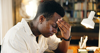 Buy stock photo Black man, student or headache in home with stress, mistake or frustrated with education course. Academic, anxiety or studying in living room for assessment deadline, brain fog or overwhelmed by debt