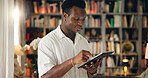 Home, student and black man with tablet for education, college website and check results for exam. Library, male person and reading with digital for university research, test information and learning