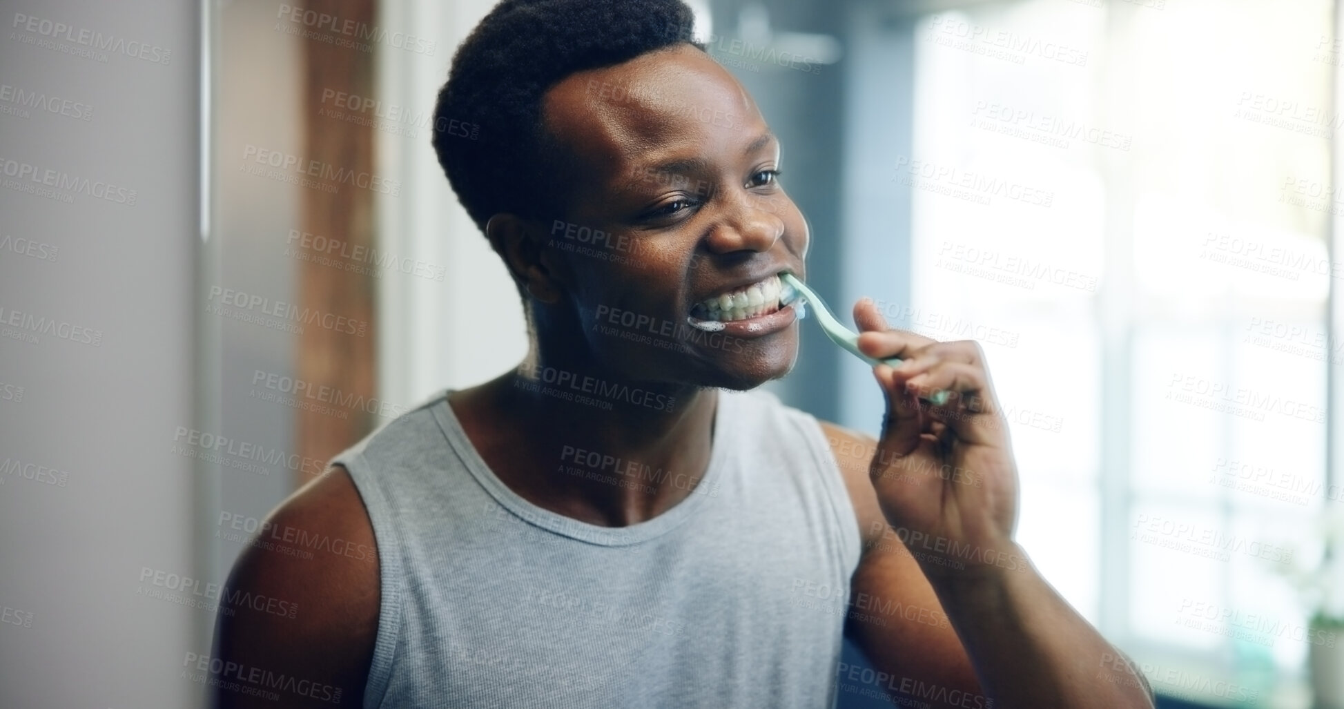 Buy stock photo Dental, bathroom and morning with brushing teeth of black man for oral hygiene, tooth grooming or gum health. Self care, cleaning routine and cavity prevention with person and toothbrush at home