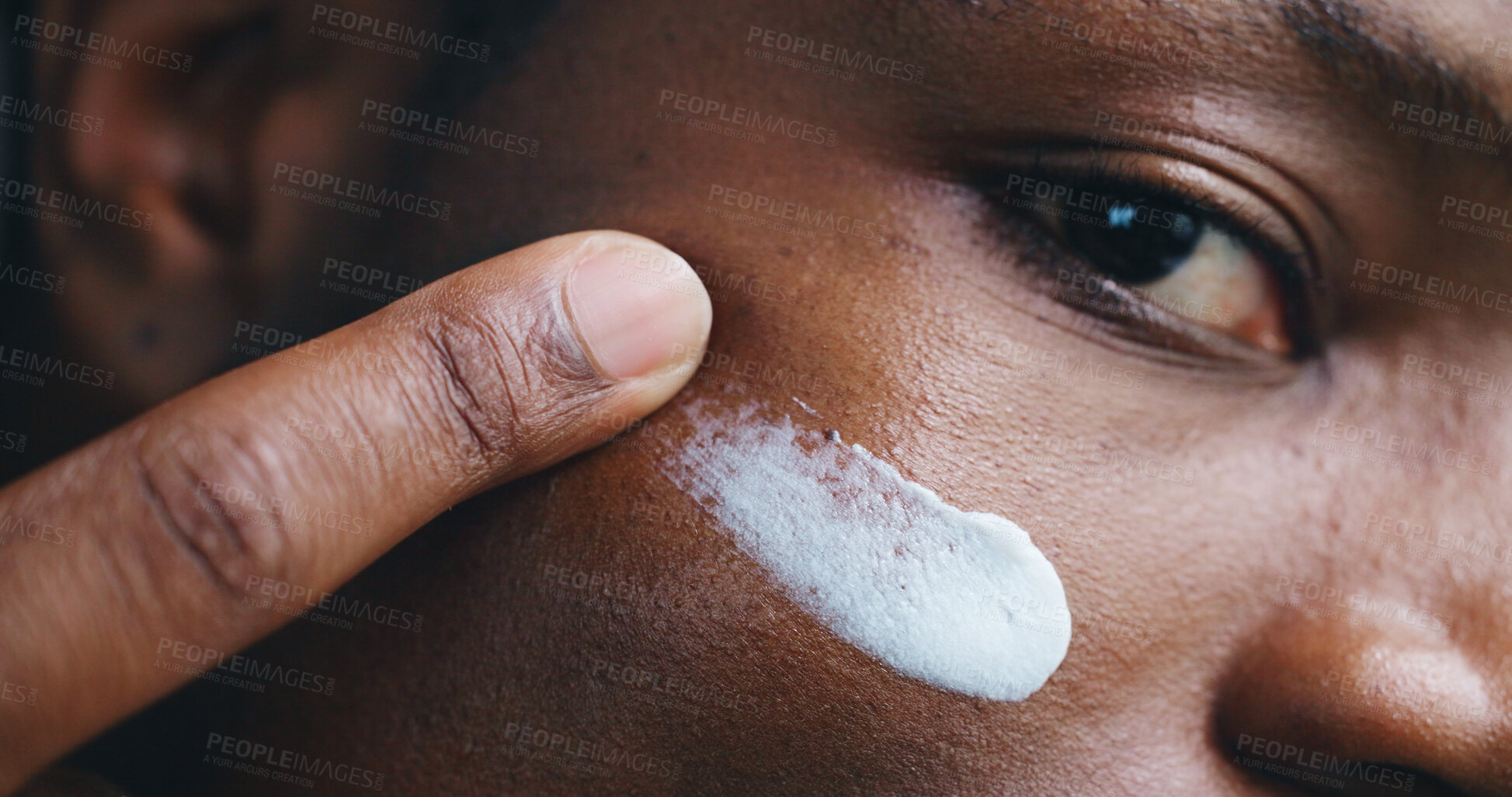 Buy stock photo Face, skincare lotion and black man apply moisturizer for treatment and beauty. Portrait, cosmetics product and closeup of cream for dermatology, facial sunscreen and under eye hydration application