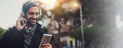 Buy stock photo Headphones, music and smile with man in city for streaming, online audio and podcast. Happiness, connection and phone with person in urban town with mobile app for banner, playlist and subscribe