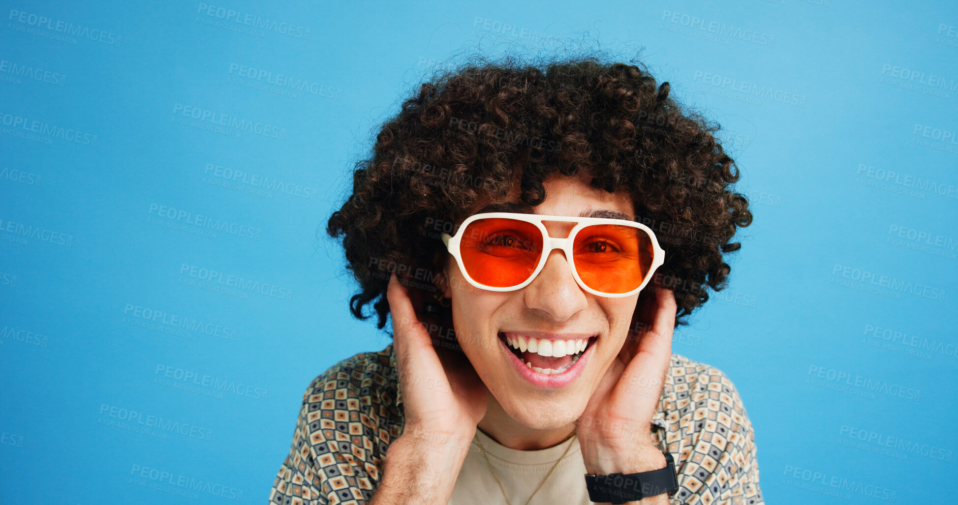 Buy stock photo Happy man, portrait and sunglasses with funky style for fashion on a blue studio background. Face, male person or hipster model with smile, afro or curly hair for stylish accessory on mockup space