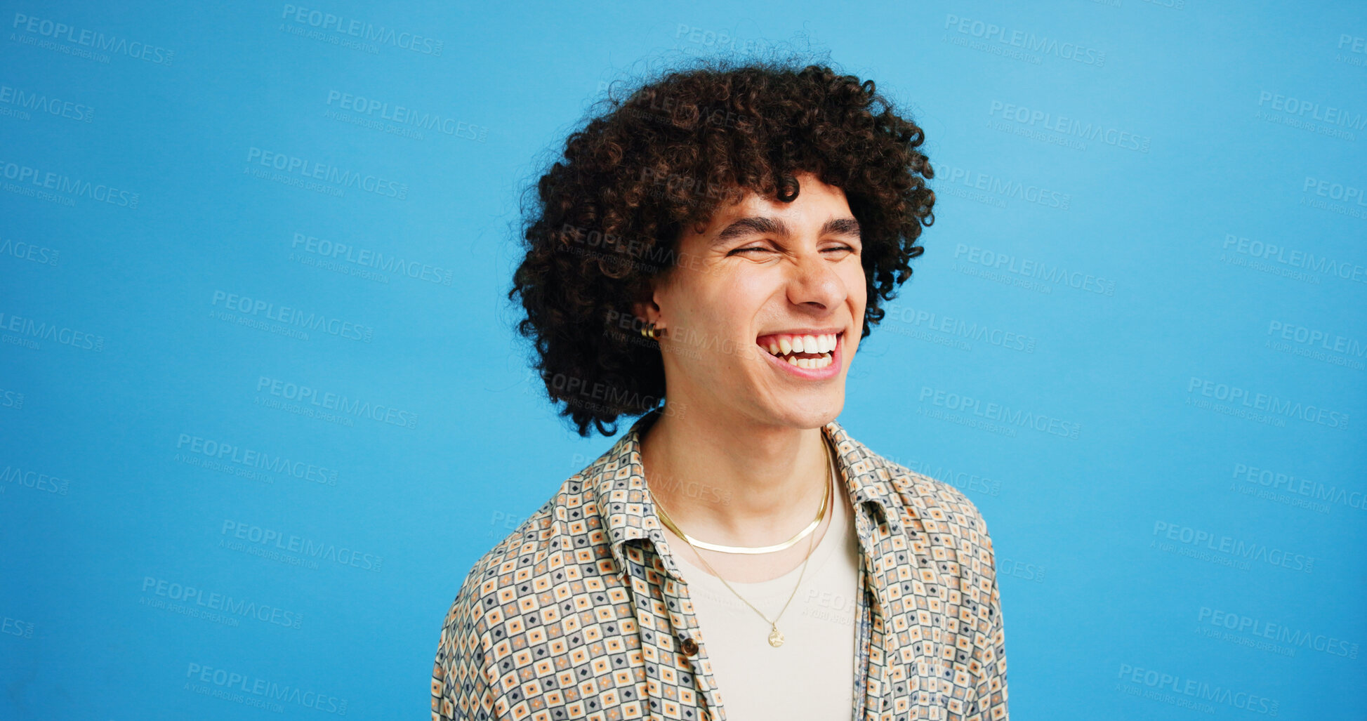 Buy stock photo Man, student and happy in studio with fashion, good mood and funny joke at space. Person, laughing and academic on blue background for scholarship opportunity, comedy and reaction in casual style