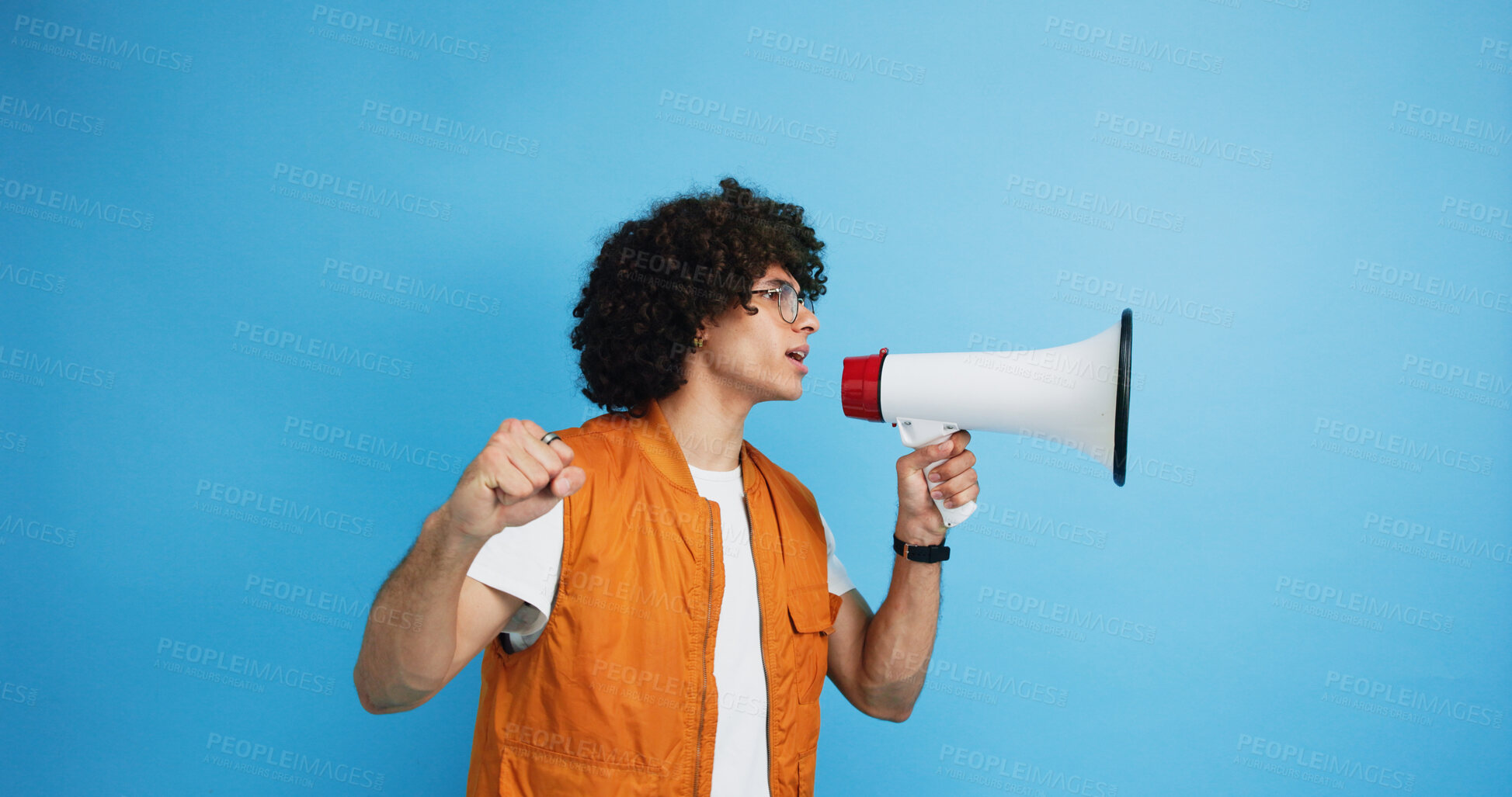 Buy stock photo Man, profile and protest with bullhorn in studio for strike, announcement or communication on a blue background. Male person, rebel or march with loudspeaker for awareness, alert or message on space