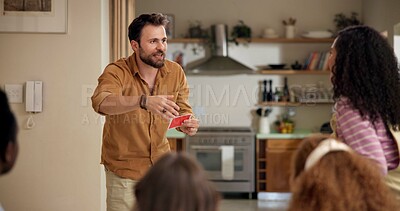 Buy stock photo Man, guess game and playing in home with friends for challenge, fun and bonding together. Person acting, excited pantomime and party for weekend, social gathering or activity in living room at house